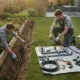 Two men installing a garden irrigation system beside raised garden beds.